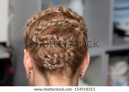 braided hairstyle of hair in a beauty salon