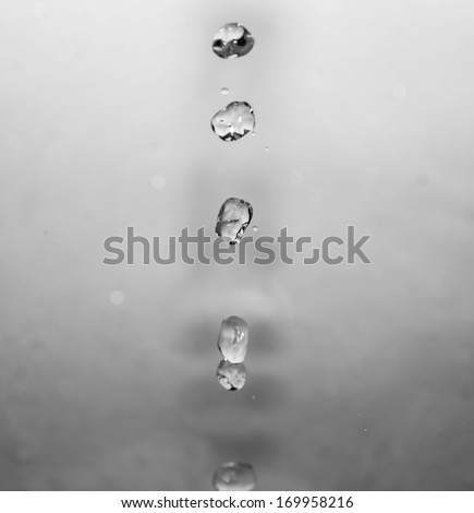 a jet of water on a gray background