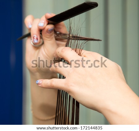 Women's haircut scissors at salon