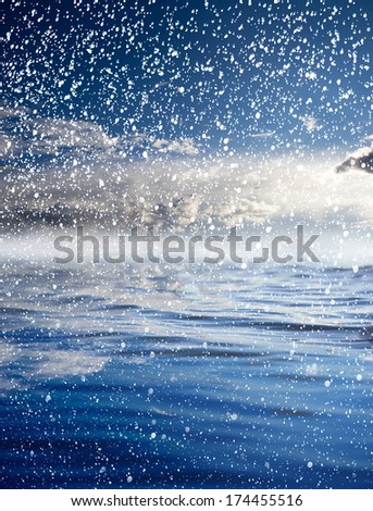 snowing at sea with a beautiful sky. beautiful background