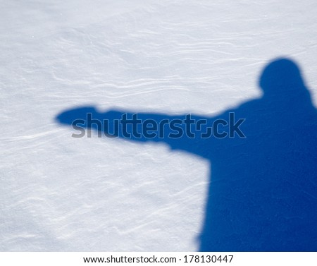 shadow of a man in the snow