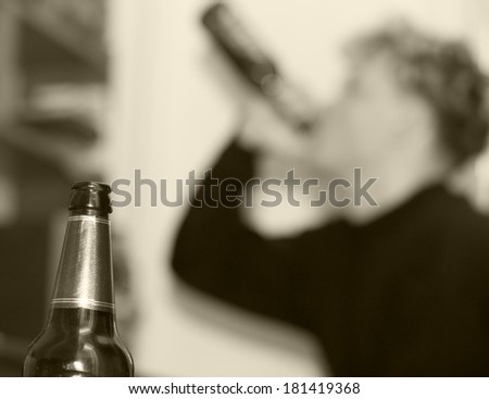 bottle of beer on background, beer drinker