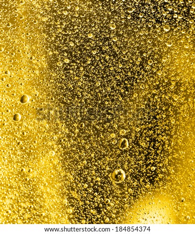 water drops on a gold background. macro