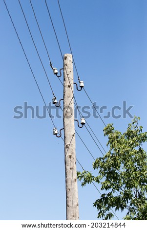 wooden pole with electricity