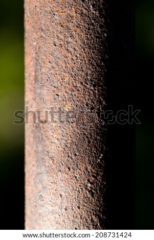 rusty pipe on black