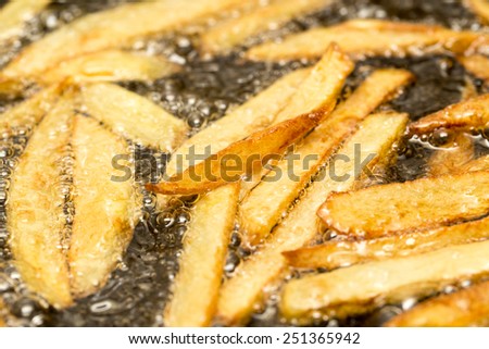 French fries fried in a pan