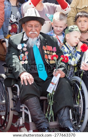 SHYMKENT city, KAZAKHSTAN MAY 9, 2015: Veterans of War. Victory Day. The memory of soldiers of the Great Patriotic War. Victory Day celebration in the city of Shymkent, Kazakhstan May 9, 2015
