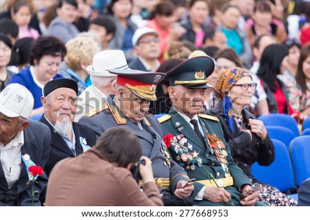 SHYMKENT , KAZAKHSTAN MAY 9, 2015: Victory Day in memory of the soldiers of the Great Patriotic War. Victory Day celebration in the city of Shymkent, Kazakhstan May 9, 2015