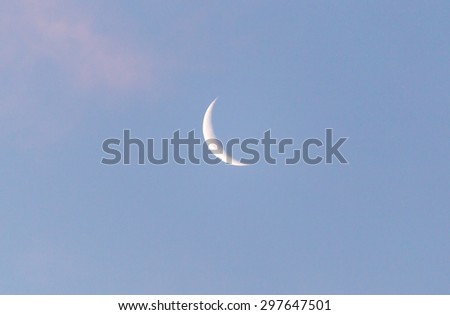 the moon in the sky at dawn