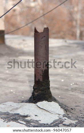 Rusty pipe on a roof