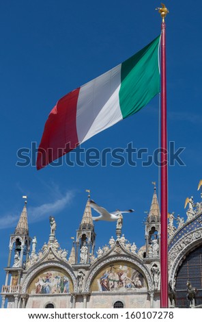 Saint Mark\'s Basilica in Venice, Italy showing the ornate outer architecture and paintings