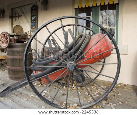 Old pioneer era tool for firefighting mounted on cannon style wheels