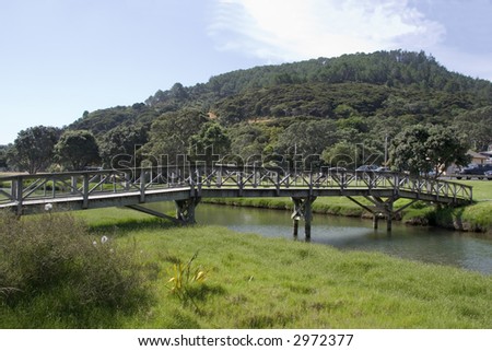 Old wooden bridge over small stream on the Coromandel peninsula of the North Island of New Zealand