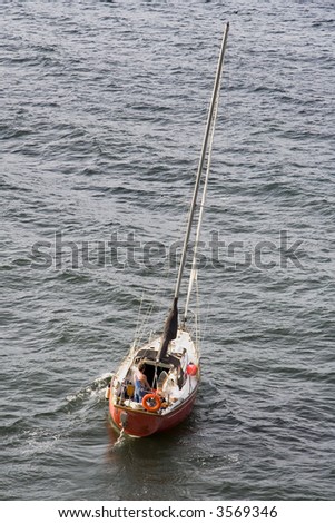 Shot of a small sailboat in the water near Victoria, British Columbia, Canada on a cloudy day