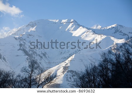 A snow-covered mountain peak in the mountains of Utah during the winter
