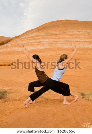 Woman doing yoga in the wilderness at sunset against a beautiful wilderness backdrop