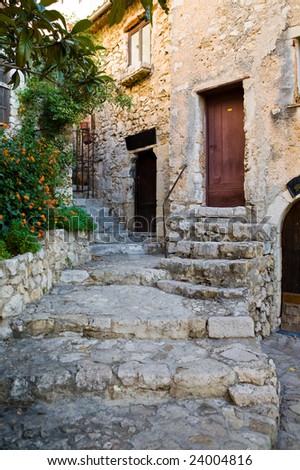 Steps on a street and doors in the medieval city of Exe, France, which is a fortress, built on cliff-side hill