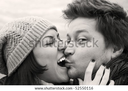 stock photo Loving couple kissing black and white