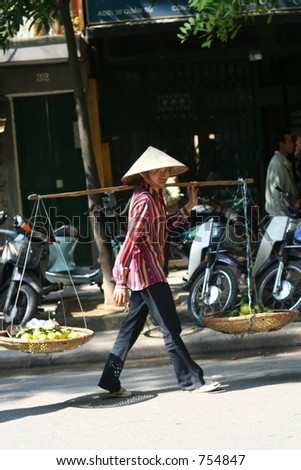 Carrier in Hanoi. You may see many carrier with a bar in their shoulder around Hanoi