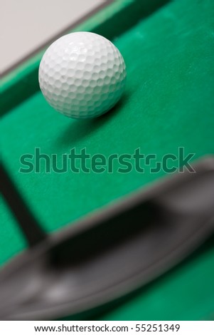 Minigolf - golf ball and a putter