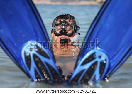 Funny snorkel man in the sea