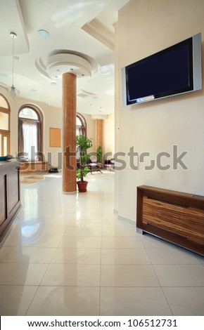 Interior of a hotel, view on reception and waiting room.