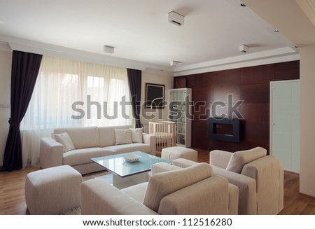 Interior of a modern living room in white.