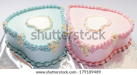 Birthday cakes for twins, for a boy and a girl, shape of hearts.