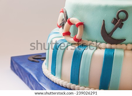Details of a birthday cake, decoration as sailing boat.