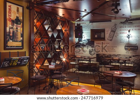 Cacak, Serbia - January 23, 2015: Velvet Cafe and Club interior, modern design with vintage chairs and tables and illustrative wallpapers.