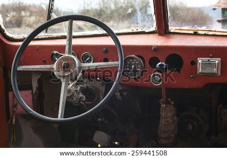 Old bus interior, view on steering wheel and control table.