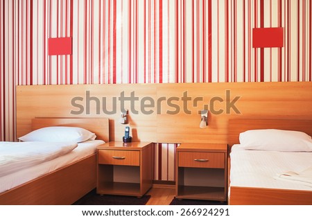 Hotel room interior, calm and peaceful atmosphere in red and white.