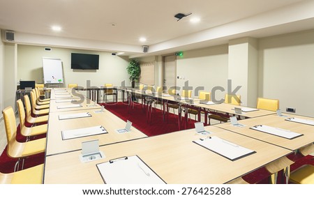 Interior of a modern conference room, tables with built in power supply.