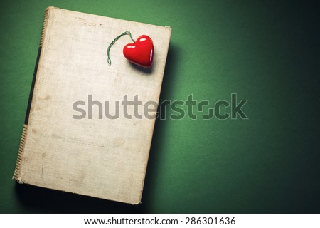 Simple conceptual composition presenting love of book.