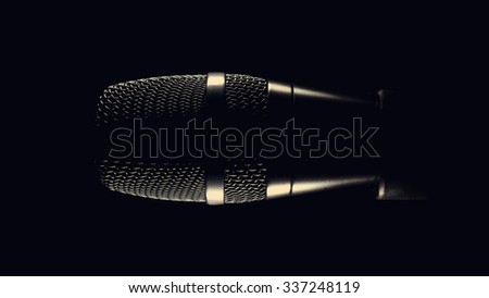 Black modern microphone on stand, black dark background. Accentuated shapes with light.
