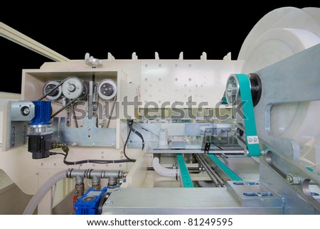 Details of a packaging machine for rolls, serviettes and handkerchiefs.