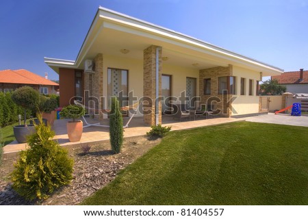 House exterior with landscaped garden.
