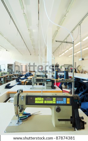 Sewing factory warehouse interior, various materials inventory.