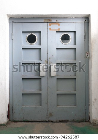 Just a door, old elevator door inside factory.