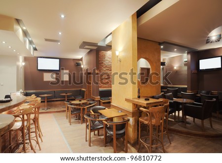 Modern and simple cafe interior with wooden classical furniture.