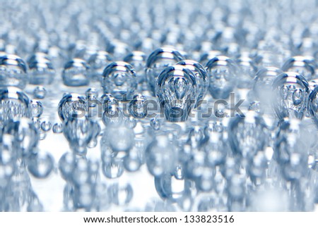 Mineral water macro - carbon dioxide bubbles on the bottom of a glass