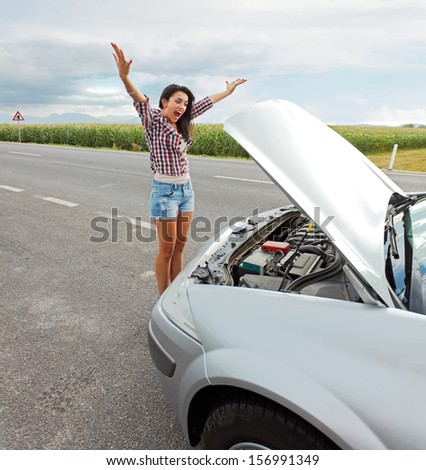 Mad woman shouting in anger because of her car\'s failed engine