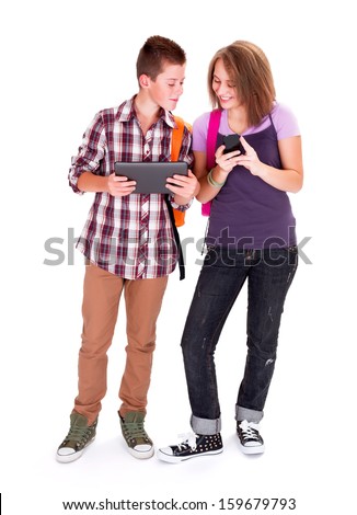 Teenager boy and his girlfriend looking at each other's mobile device