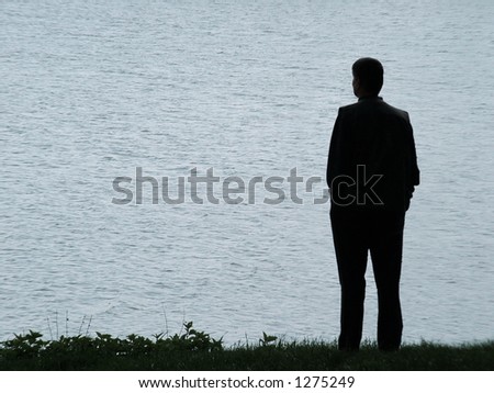 Man silhouette at lakeside