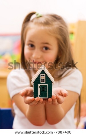 stock photo Girl showing her wish to their parents a new home focus