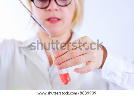 Scientist woman analyzing chemical material in test tube