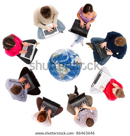 stock photo : Social network members typing on laptop computers, seen from above