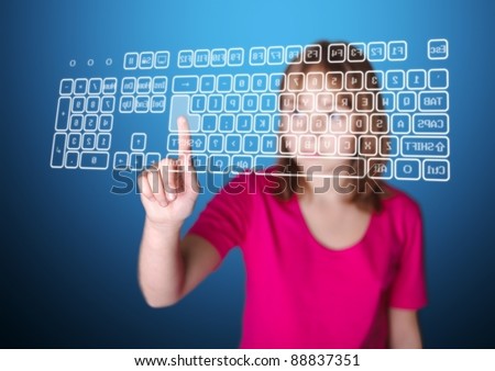 Girl standing in front of virtual screen, pressing enter key on keyboard