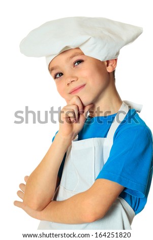 Six years old cook boy isolated on white