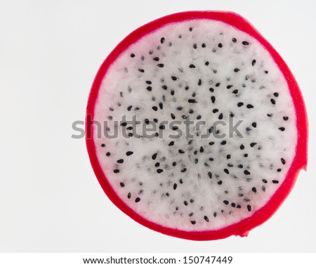 Closeup of sliced dragon fruit with red rind/Sliced Dragon Fruit/Sliced Dragon Fruit showing red rind, white pulp and seeds